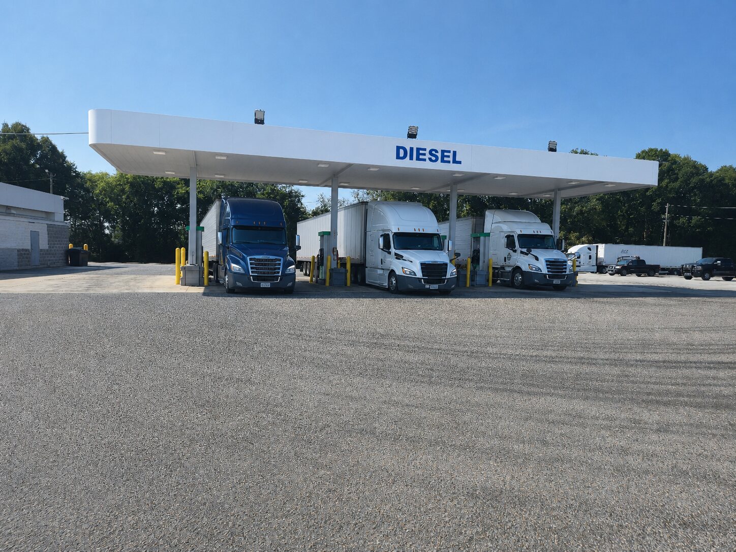 Semi trucks at Tiger Pride Mart diesel pumps